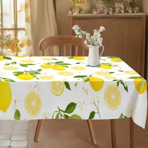 Detail shot of a fresh lemon pattern tablecloth, perfect for dining room and home decor.