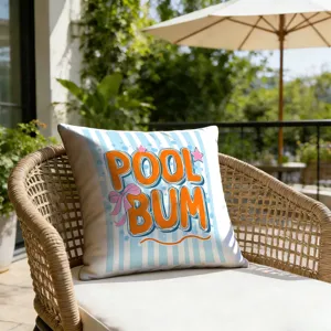Close-up of decorative outdoor pillowcase with blue stripes and playful orange pool text.
