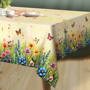 Detail view of spring floral tablecloth with vibrant butterflies and wild flowers, table decor.