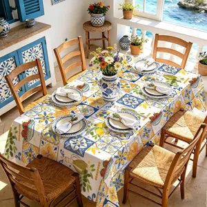 Mediterranean style floral lemon tablecloth detail, vibrant blue and yellow dining table decor.