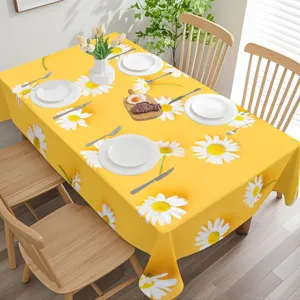 Bright yellow floral tablecloth with daisy print, decorative home dining table cover.