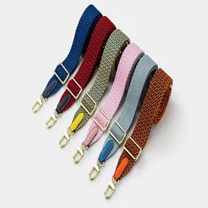 Colorful woven replacement shoulder strap with adjustable metal buckle and leather ends detail.