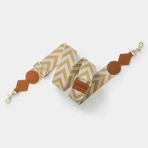 Adjustable wide shoulder bag strap featuring a chic chevron pattern and leather accents.