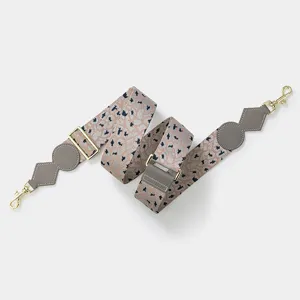 Adjustable wide replacement shoulder strap for crossbody bags with gold hardware details.