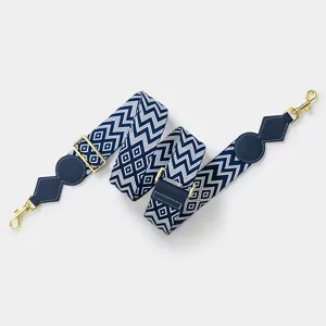 Adjustable wide replacement bag strap with blue geometric pattern and gold hardware details.