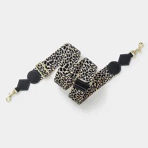Leopard print wide bag strap replacement with black leather trim and gold hardware details.
