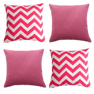 Detailed view of 4-piece waterproof outdoor pillow covers featuring geometric chevron and solid pink.