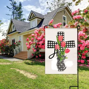 Detailed view of the Easter garden flag featuring floral tulip and cross print for spring decor.