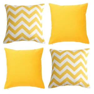 Detail view of 4-piece yellow chevron and solid throw pillow covers set for sofa decoration.