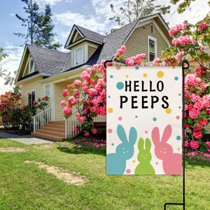 Easter garden flag detail featuring cute pastel bunnies and colorful polka dots design.