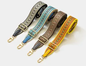 Adjustable woven replacement bag strap with gold metal hardware for shoulder crossbody bags.