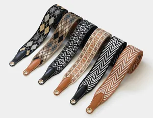 Detailed view of colorful woven replacement bag straps with geometric patterns and leather ends.