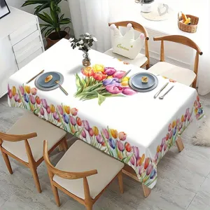 Detailansicht der farbenfrohen Aquarell Tulpen Muster Tischdecke in moderner Esszimmerszene.