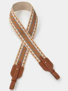 Wide replacement shoulder strap with woven geometric pattern and leather ends for crossbody bags.