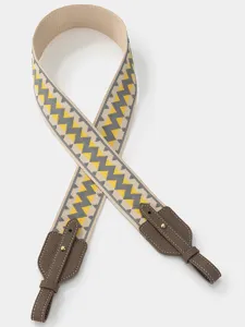 Wide replacement bag strap with chic chevron pattern and brown leather ends for crossbody bags.