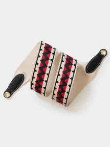 Beige geometric woven replacement shoulder strap with black leather ends for handbag, durable.
