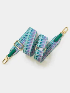 Bandoulière de sac tissée colorée avec longueur réglable, embouts en cuir vert et matériel doré.