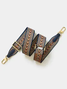 Adjustable woven replacement bag strap with gold tone hardware and chevron pattern design detail.