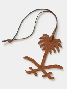 Premium leather palm tree bag charm, luxury designer style keychain pendant for handbags and keys.