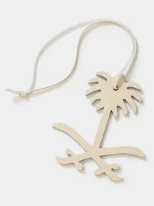 Premium leather palm tree keychain charm, stylish bag pendant in beige cowhide design.