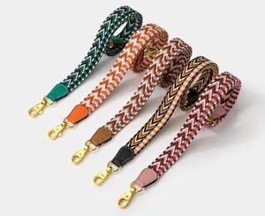 Colorful geometric pattern woven replacement strap with gold hardware for crossbody bags.