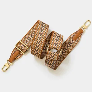 Woven bag strap replacement with adjustable length, brown chevron pattern and gold hardware details.