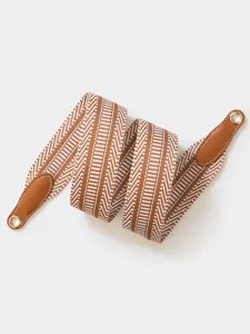 Replacement woven shoulder strap with leather ends and gold metal rings for handbag details.