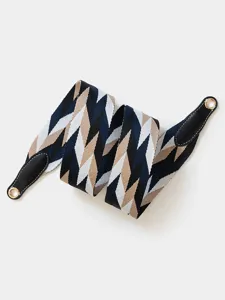 Detail view of the stylish geometric pattern replacement bag strap with leather ends.