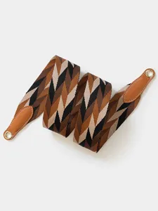 Detailed close-up of the geometric patterned replacement bag strap featuring sturdy leather ends.