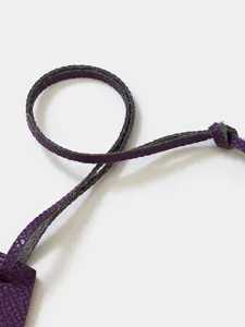 Purple textured leather strap detail shot, premium cowhide key ring accessory close up