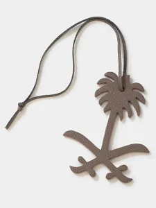 Luxury leather palm tree sword charm pendant for handbag and car keys stylish accessory.