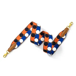 Stylish geometric patterned wide replacement bag strap with leather tabs and gold hardware.