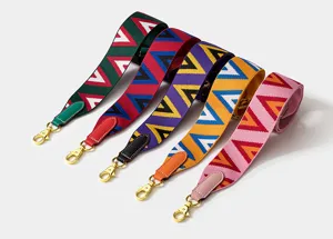 Bandoulière de rechange tissée élégante pour sacs à main de créateur avec motif géométrique coloré.