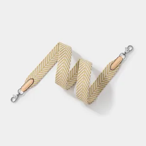 Bandoulière de rechange tissée avec motif à chevron et embouts en cuir pour sacs de luxe.