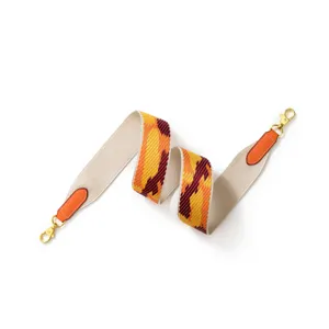 Wide woven replacement shoulder strap for handbags, colorful geometric canvas with leather ends.