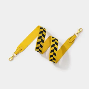 Wide jacquard replacement shoulder strap for designer handbags, yellow and black chevron pattern.