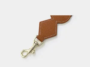 Brown leather wide replacement bag strap with gold-colored metal clasp for shoulder bags