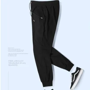Detail view of black casual sweatpants with cuffed hem and drawstring for daily comfort.
