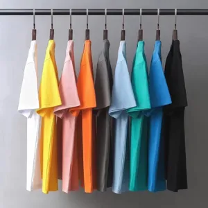 Detailed view of multi-color cotton short sleeve t-shirts hanging neatly on rack for summer.