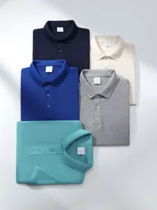 Detailed view of neatly stacked classic cotton polo shirts in multiple colors for daily wear.