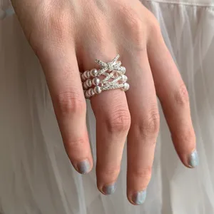 Fashion Three-Layer Artificial Pearl Wide Elastic Ring For Women Rhinestone Bow Design Chic Handcrafted Stretch Finger Jewelry