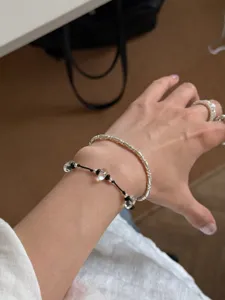 Minimalist clear crystal black cord and silver bead layered bracelet set, chic niche style.