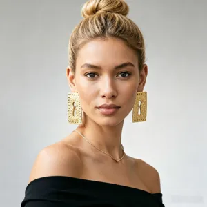 Vintage gold tone metal square keyhole statement earrings with textured finish for women detail.