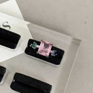 Detailed close-up of a Y2K colorful zircon stackable ring with a pink rectangular center stone.