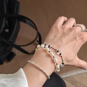 Elegant white crystal pearl bracelet set for women, niche design chic minimalist wrist jewelry.