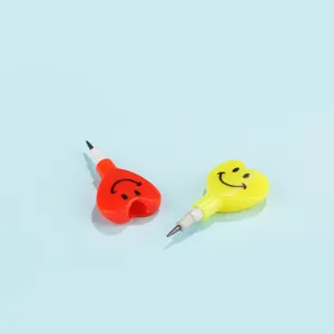 Heart-shaped stackable pencil detail showing cute smiley face and colorful plastic body
