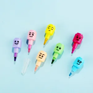 Close-up of colorful stackable cartoon crayons with funny faces for kids painting and drawing.