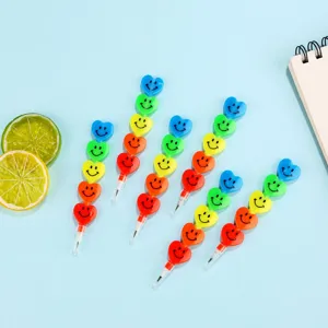 Details of colorful heart-shaped stacking pencils with cute smiley face designs for kids stationery.