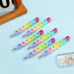 Colorful stackable crayons with cute face blocks for kids drawing and creative school stationery.
