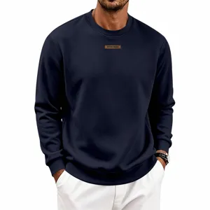 Men's navy blue crewneck sweatshirt with chest patch detail, casual long sleeve pullover top.